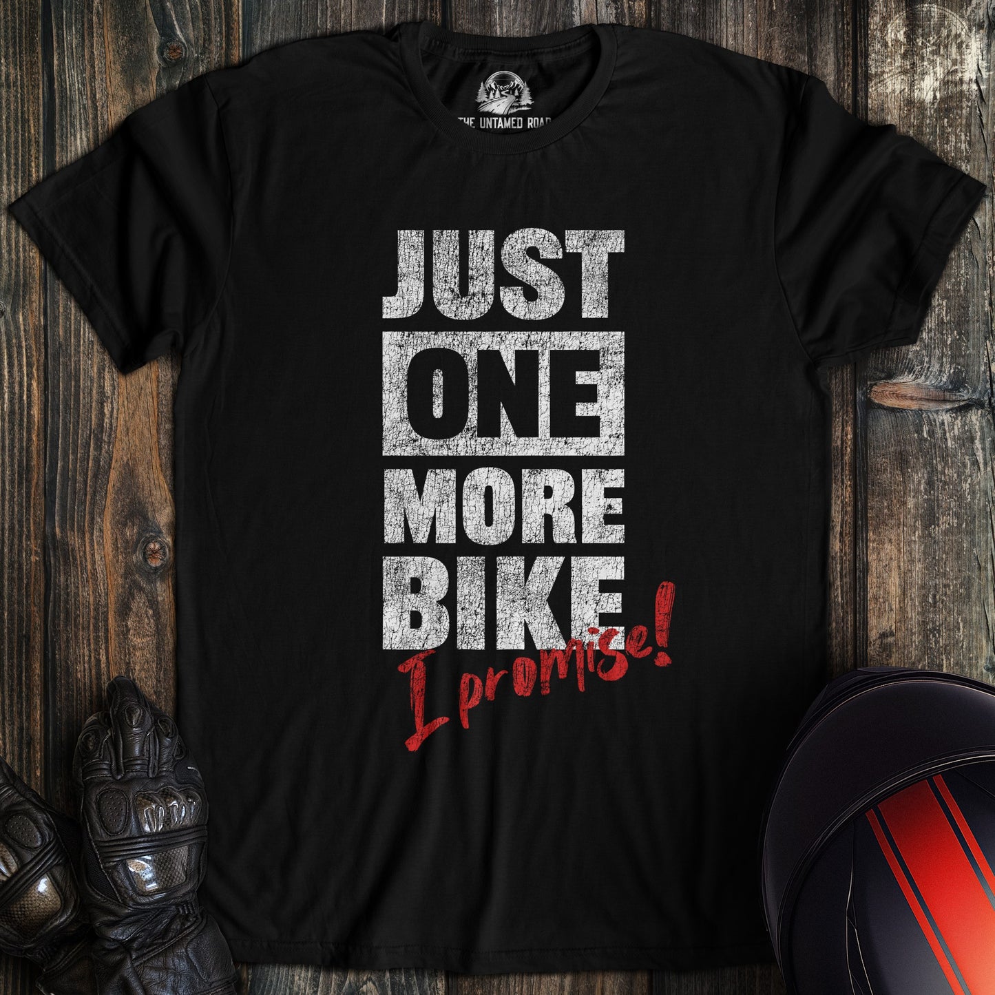 A black colored t-shirt with the words "just one more bike" printed on the front.