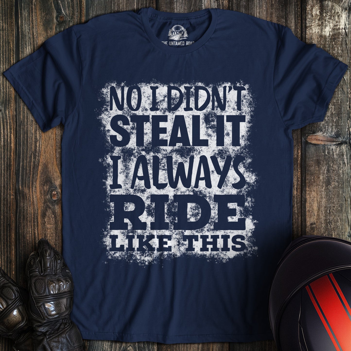 A navy colored t-shirt with the words "didnt steal it" printed on the front.