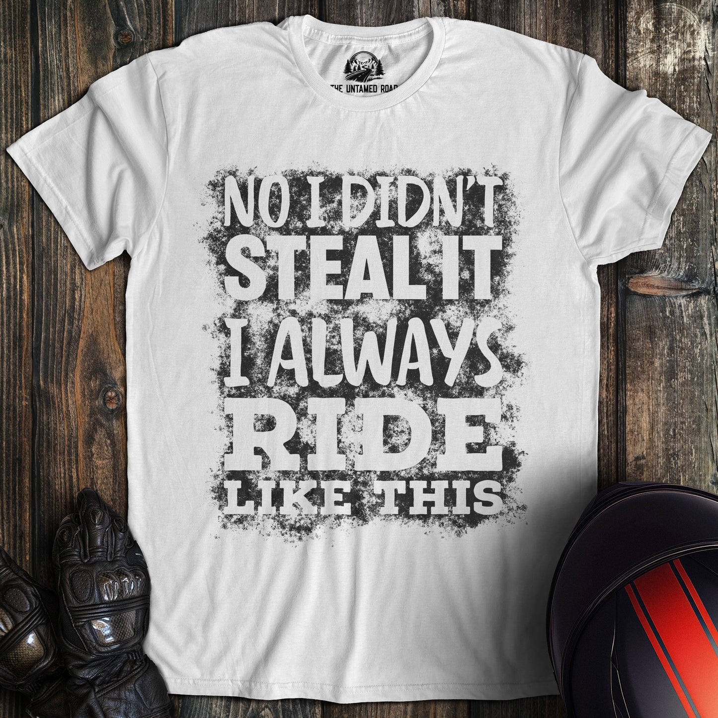 A white colored t-shirt with the words "didnt steal it" printed on the front.