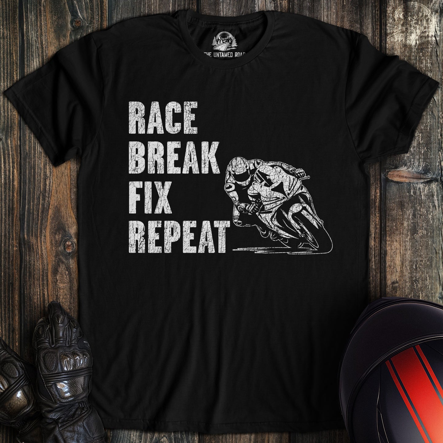 A black colored t-shirt with the words "race break fix" printed on the front.