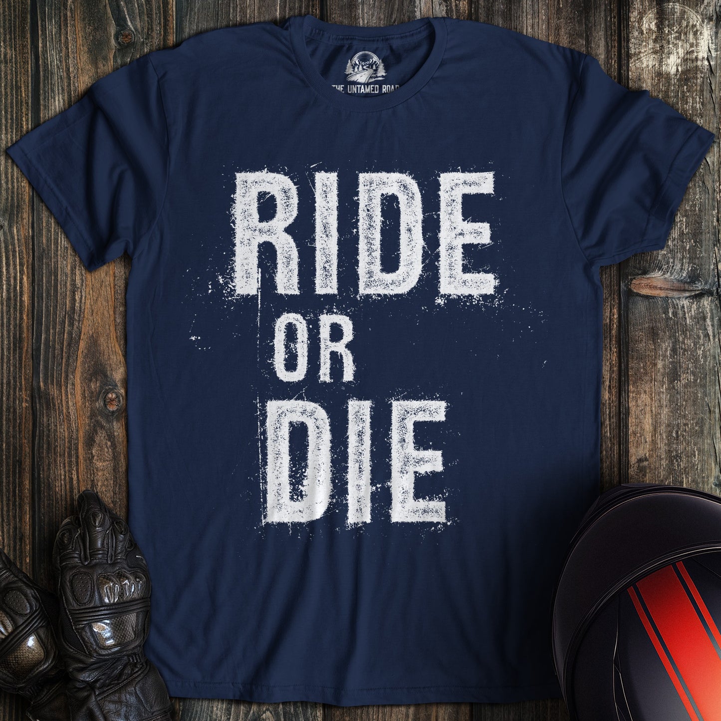 A navy colored t-shirt with the words "ride or die" printed on the front.