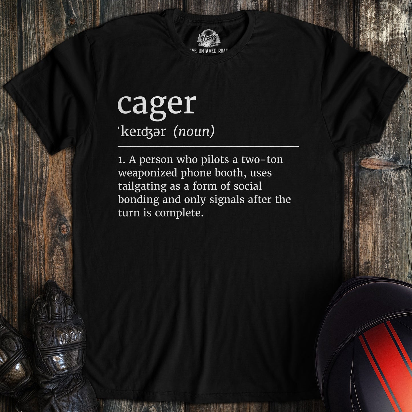 A black colored t-shirt with the words "cager definition" printed on the front.