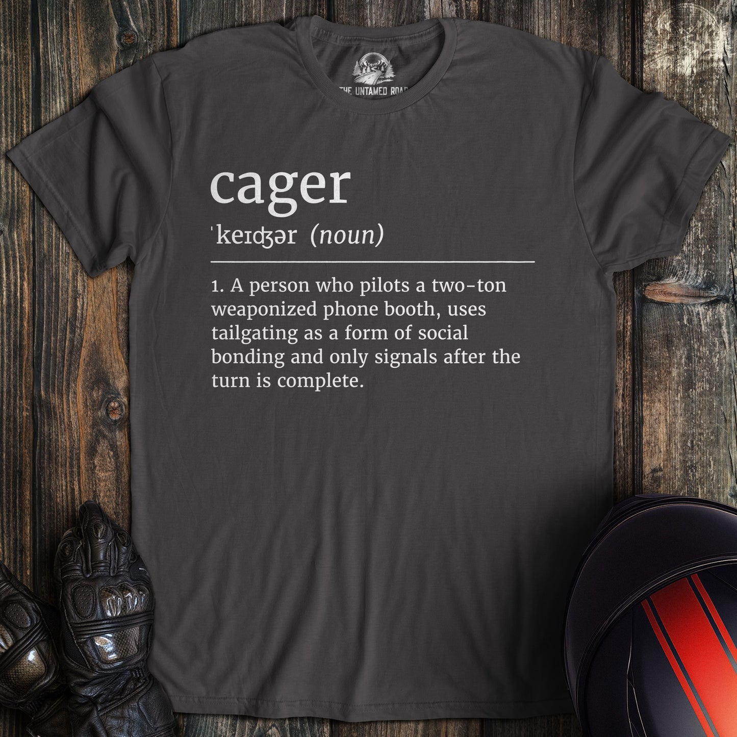 A charcoal colored t-shirt with the words "cager definition" printed on the front.