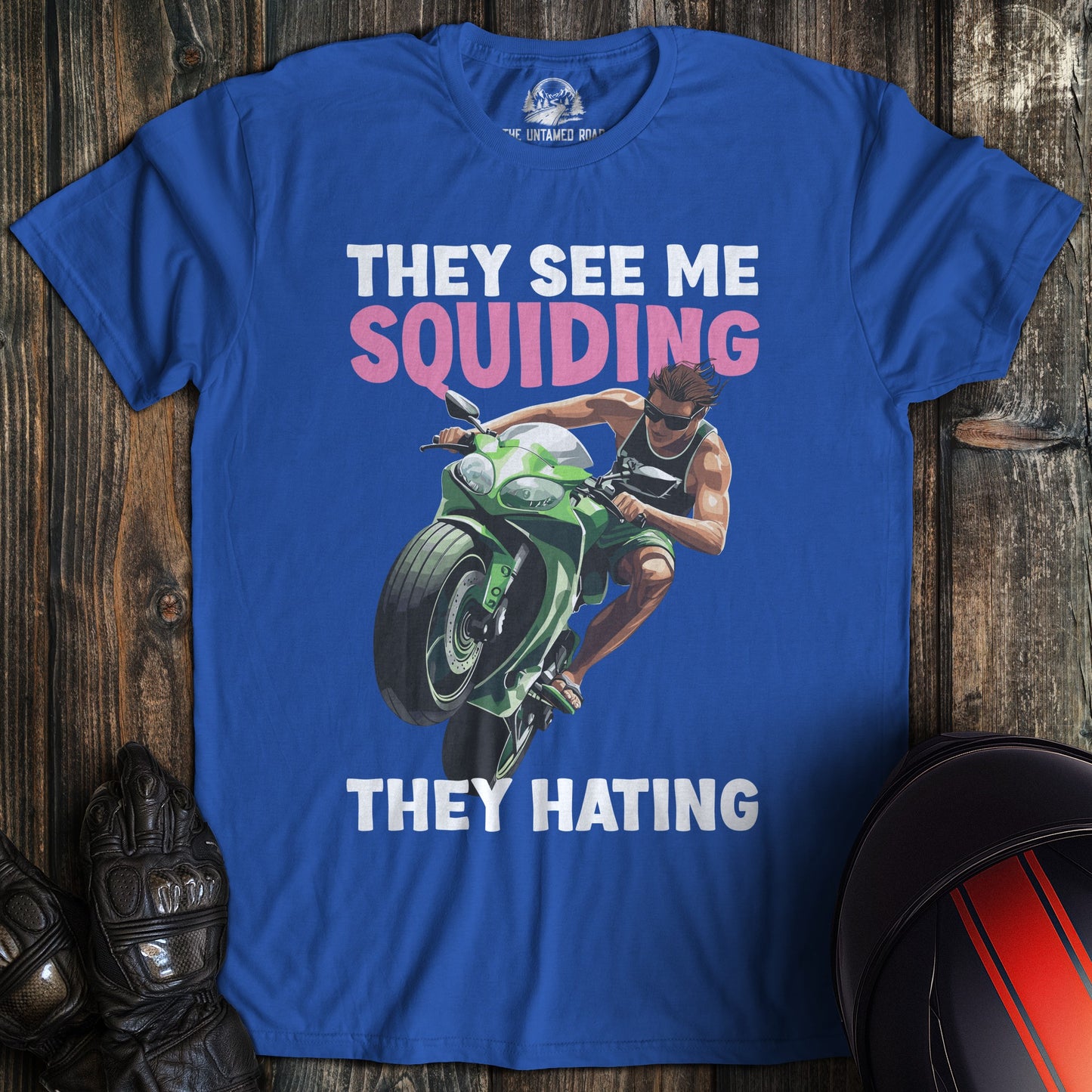 A royal blue colored t-shirt with the words "squidding" printed on the front.