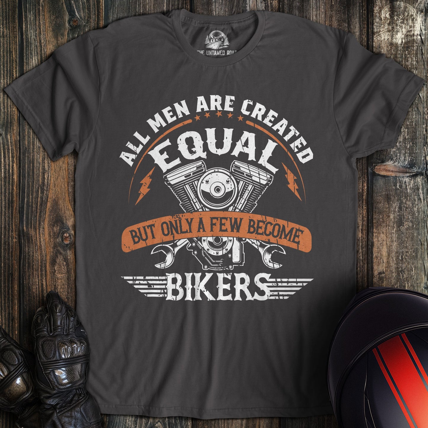A charcoal colored t-shirt with the words "men created equal" printed on the front.