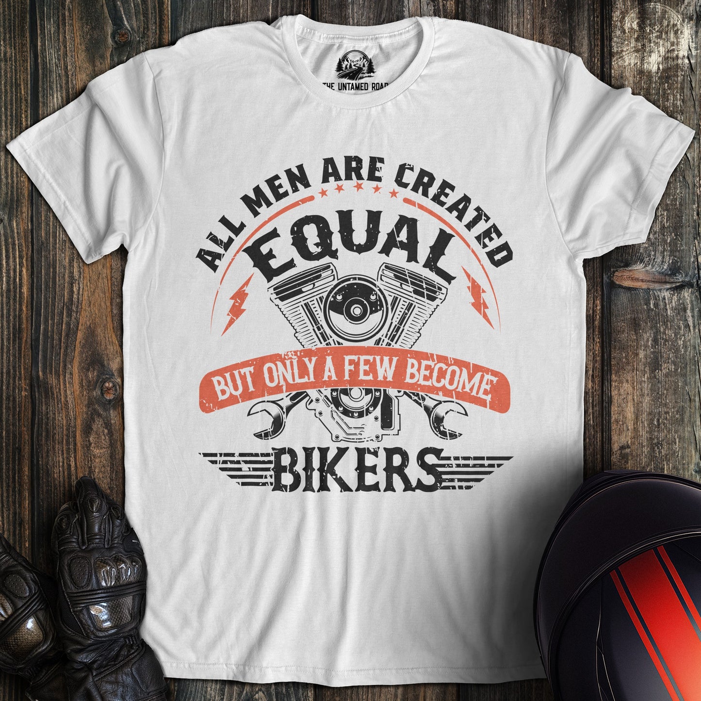 A white colored t-shirt with the words "men created equal" printed on the front.