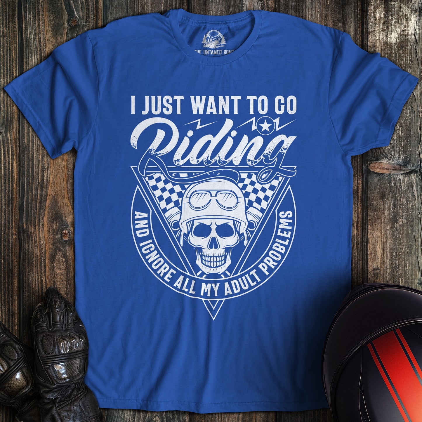 A royal blue colored t-shirt with the words "ignore adult problems" printed on the front.