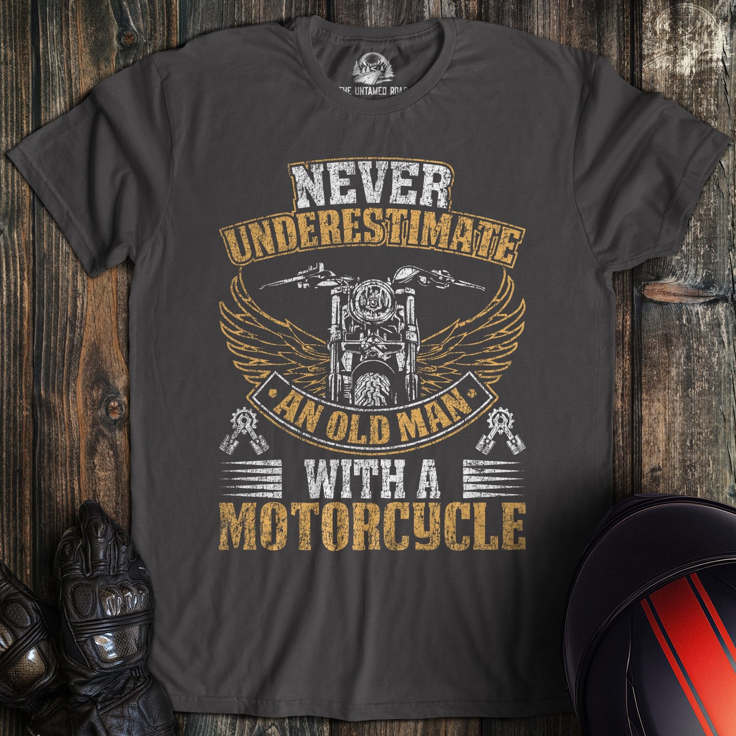 A charcoal colored t-shirt with the words "old man motorcycle distressed" printed on the front.