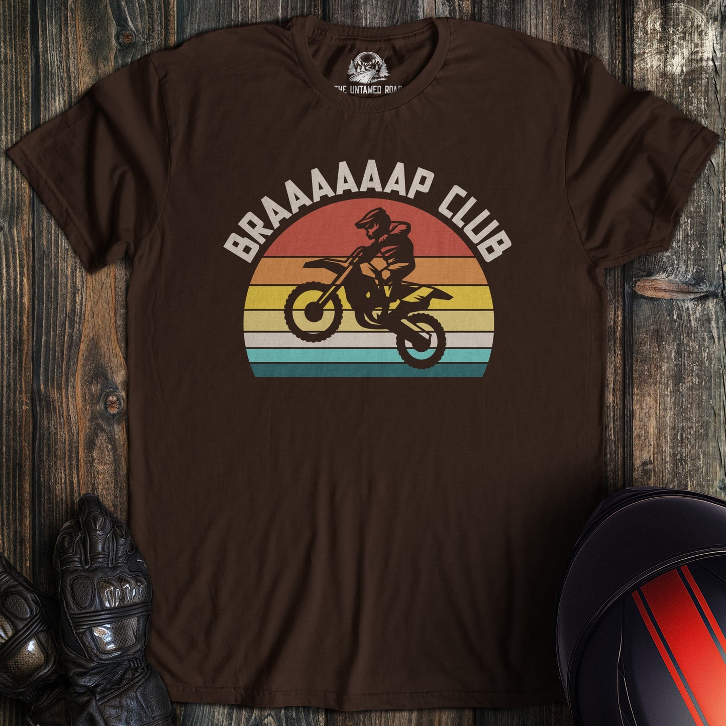 A dark chocolate colored t-shirt with the words "braap club" printed on the front.