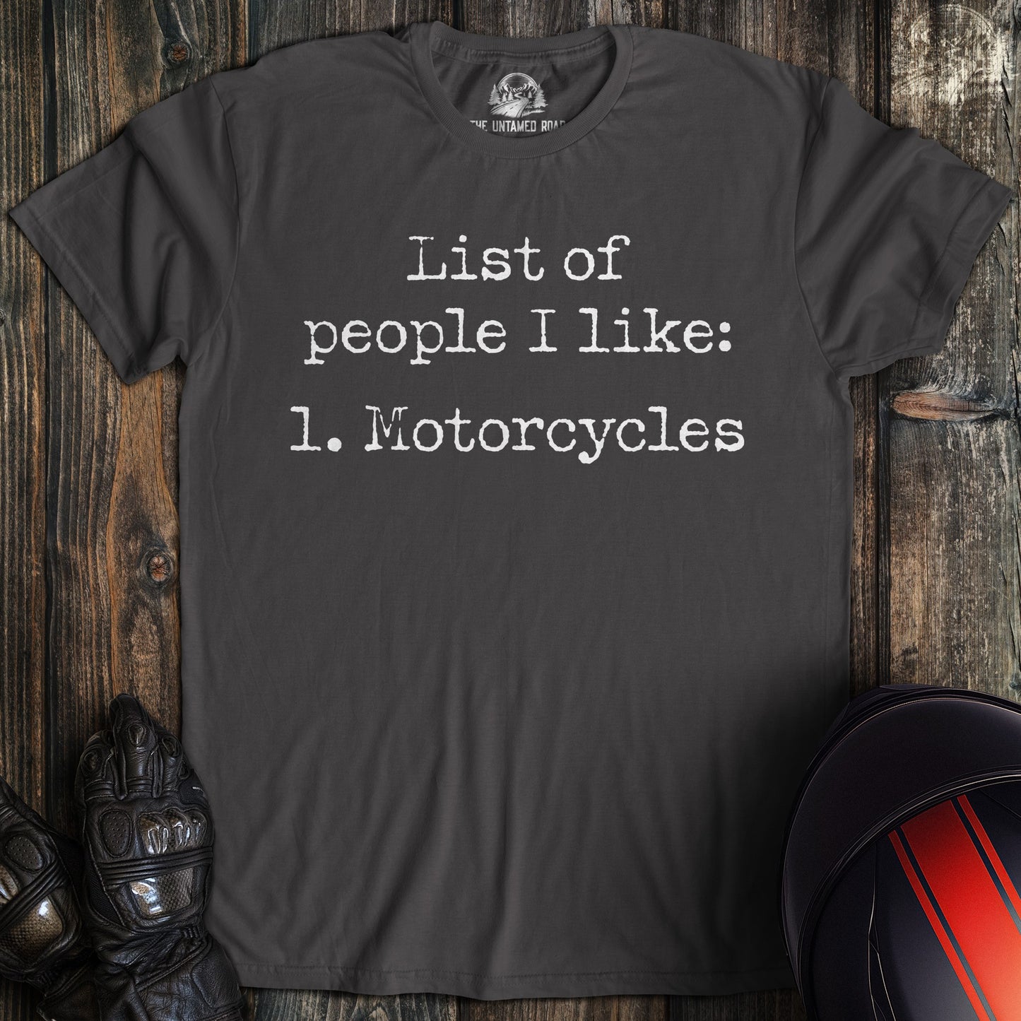 A charcoal colored t-shirt with the words "list of people ilike" printed on the front.
