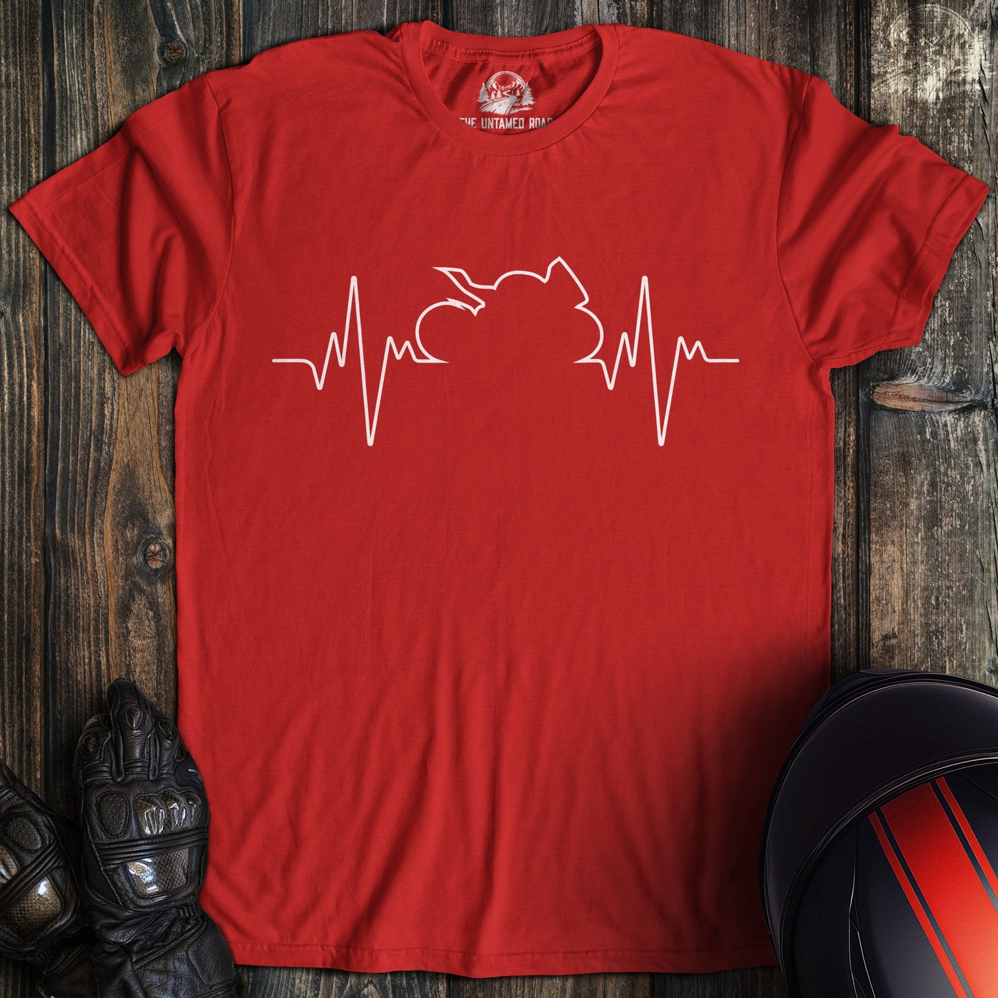 A red colored t-shirt with the words "sportbike heartbeat" printed on the front.