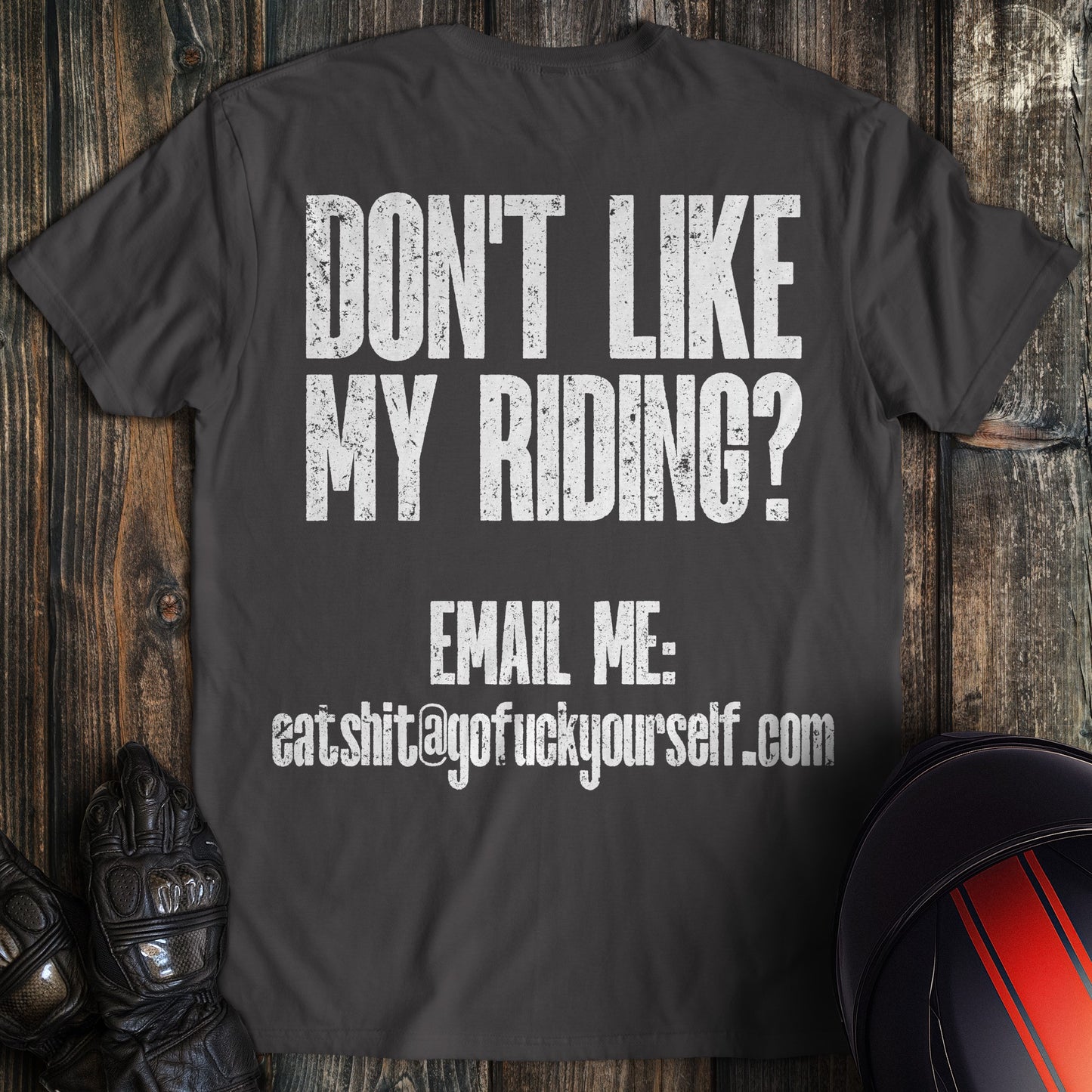 A charcoal colored t-shirt with the words "dont like riding email" printed on the back.