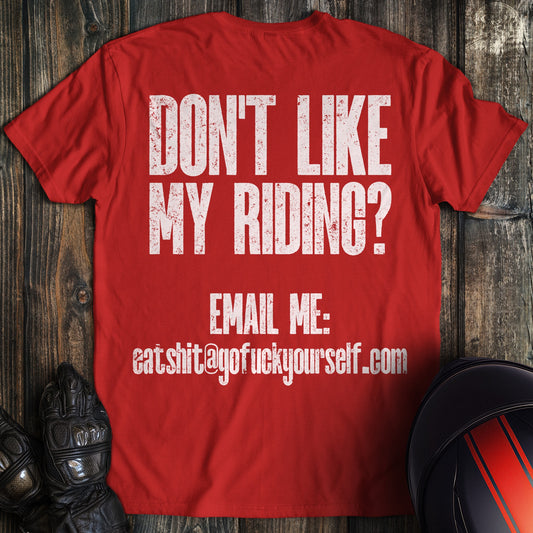 A red colored t-shirt with the words "dont like riding email" printed on the back.