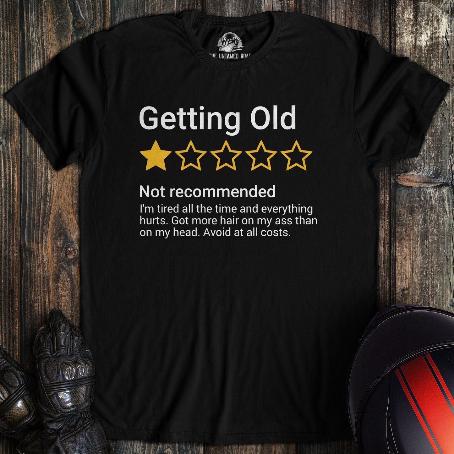 A black colored t-shirt with the words "getting old review" printed on the front.