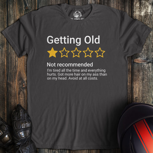 A charcoal colored t-shirt with the words "getting old review" printed on the front.