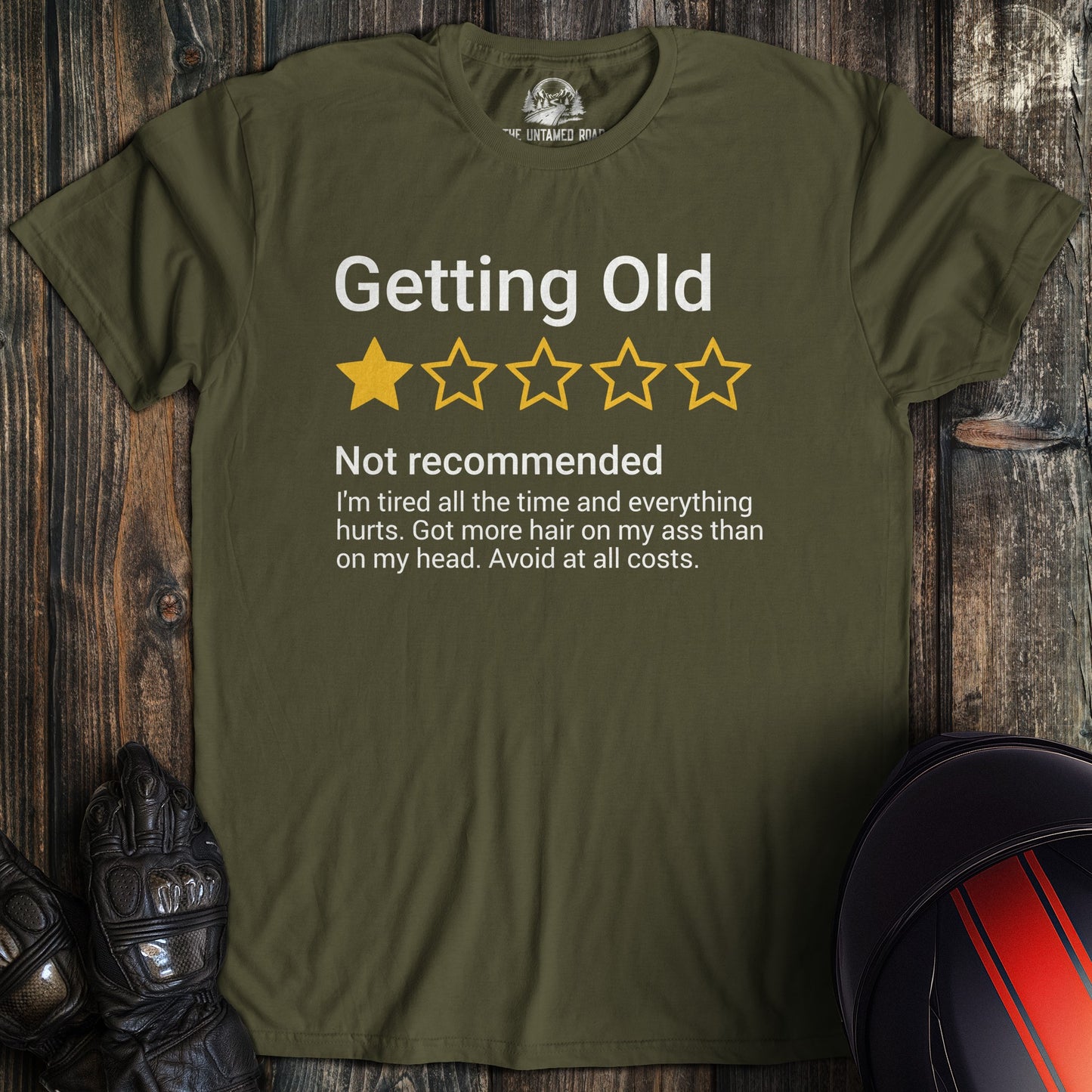 A military green colored t-shirt with the words "getting old review" printed on the front.