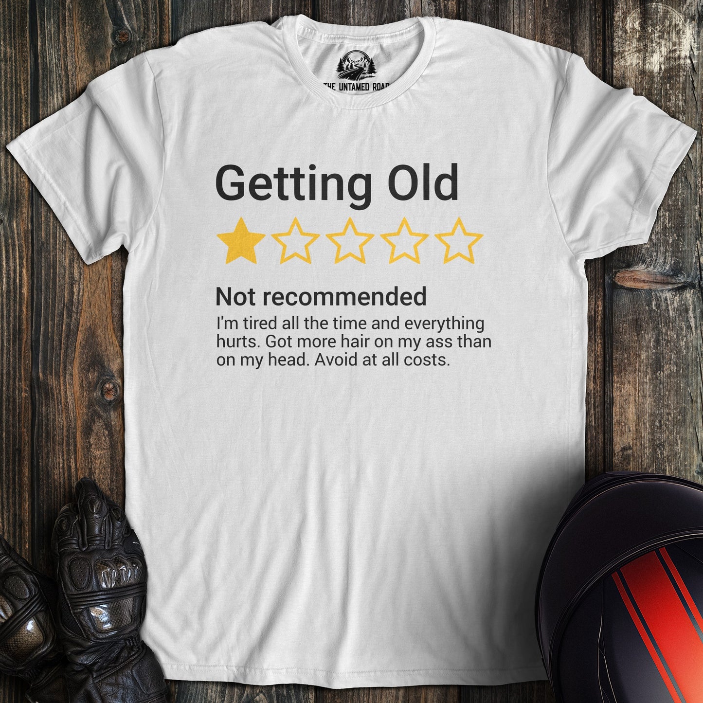 A white colored t-shirt with the words "getting old review" printed on the front.