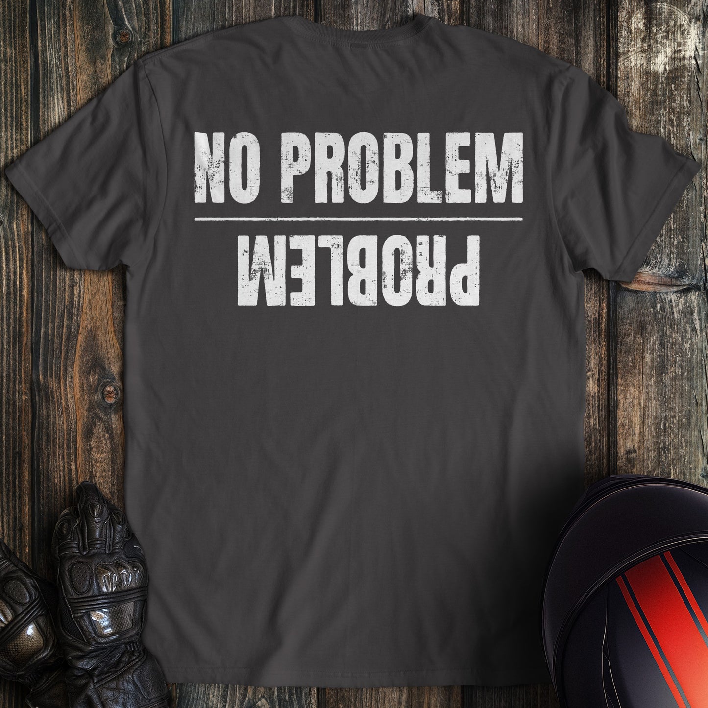 A charcoal colored t-shirt with the words "no problem problem" printed on the back.