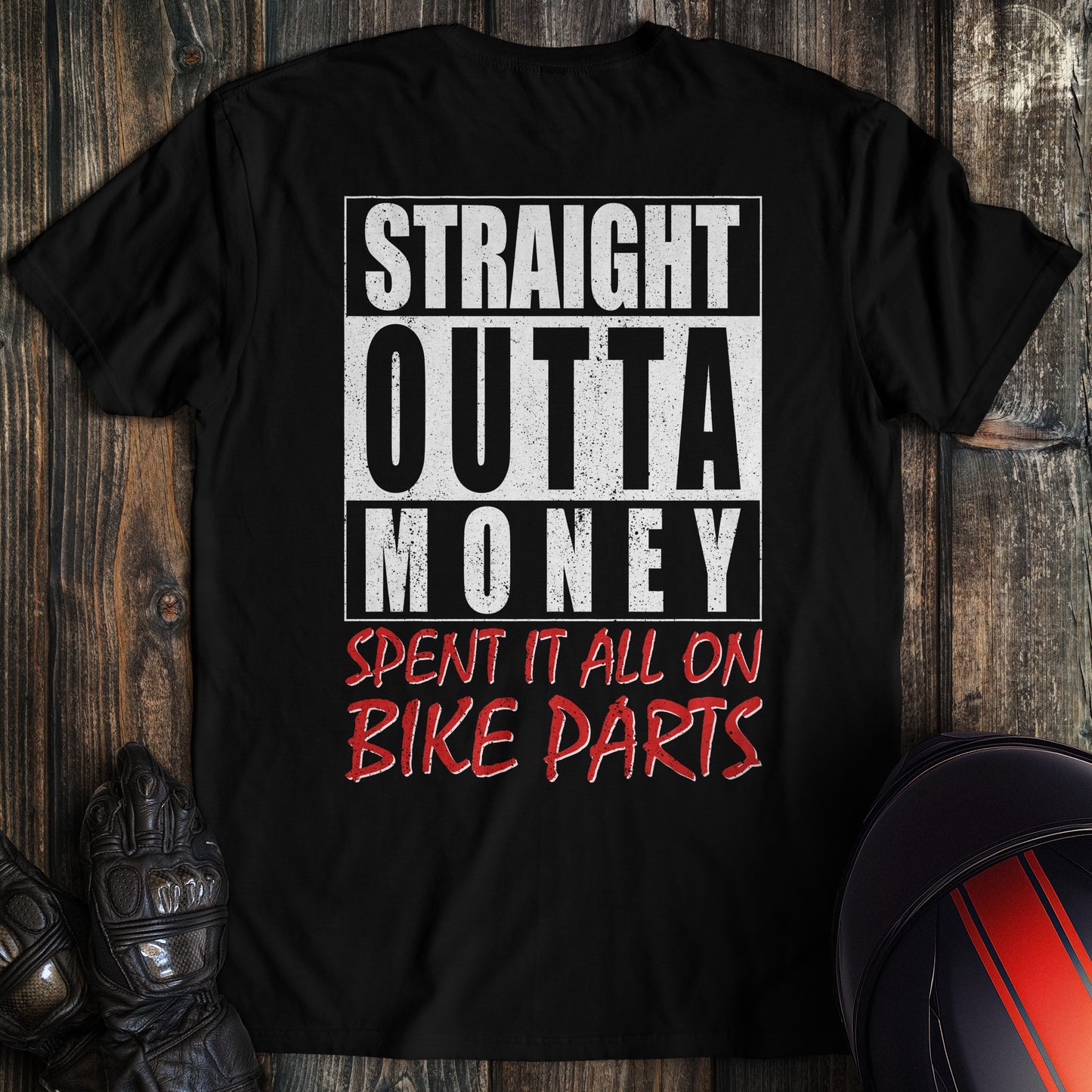 A black colored t-shirt with the words "straight outta money 2" printed on the back.