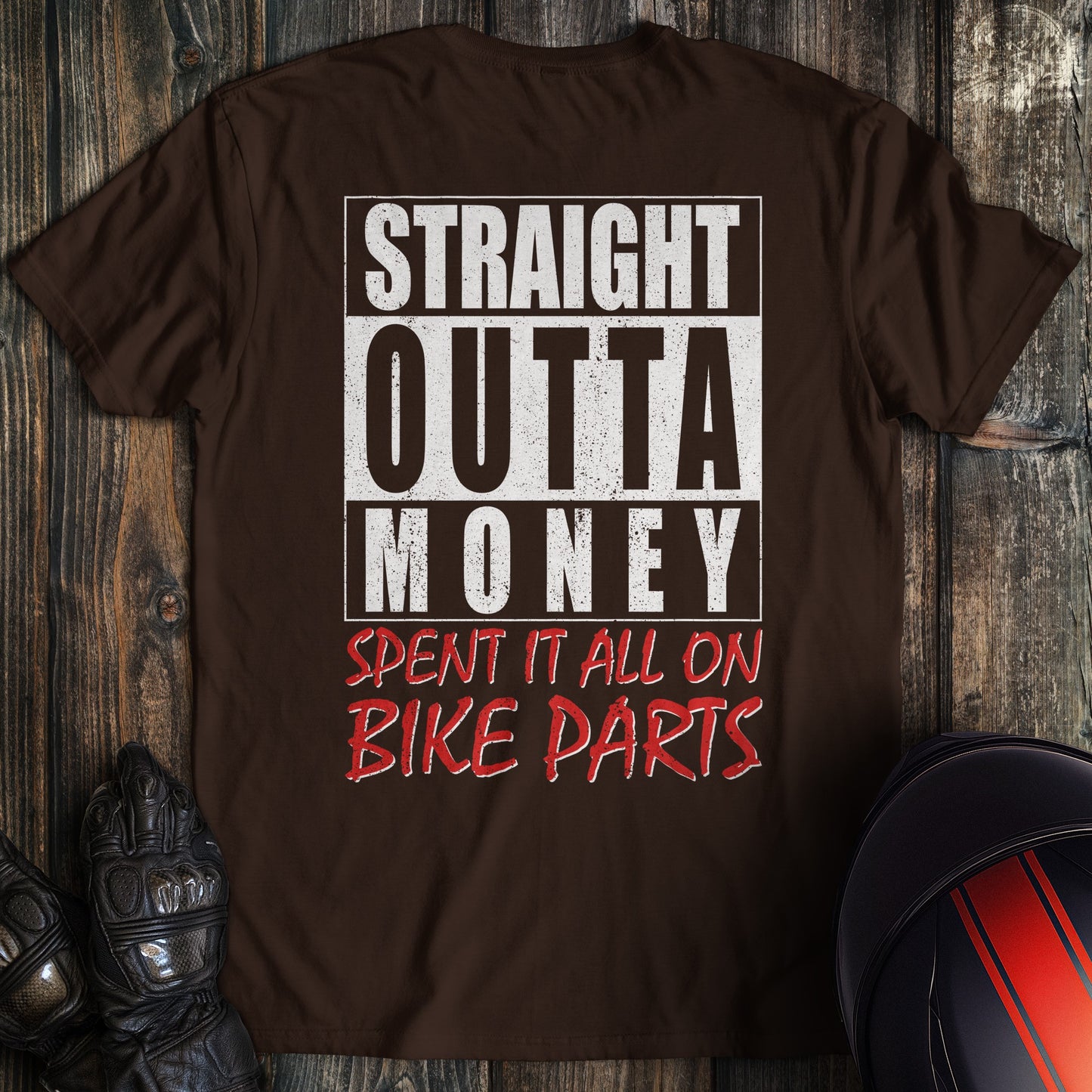 A dark chocolate colored t-shirt with the words "straight outta money 2" printed on the back.