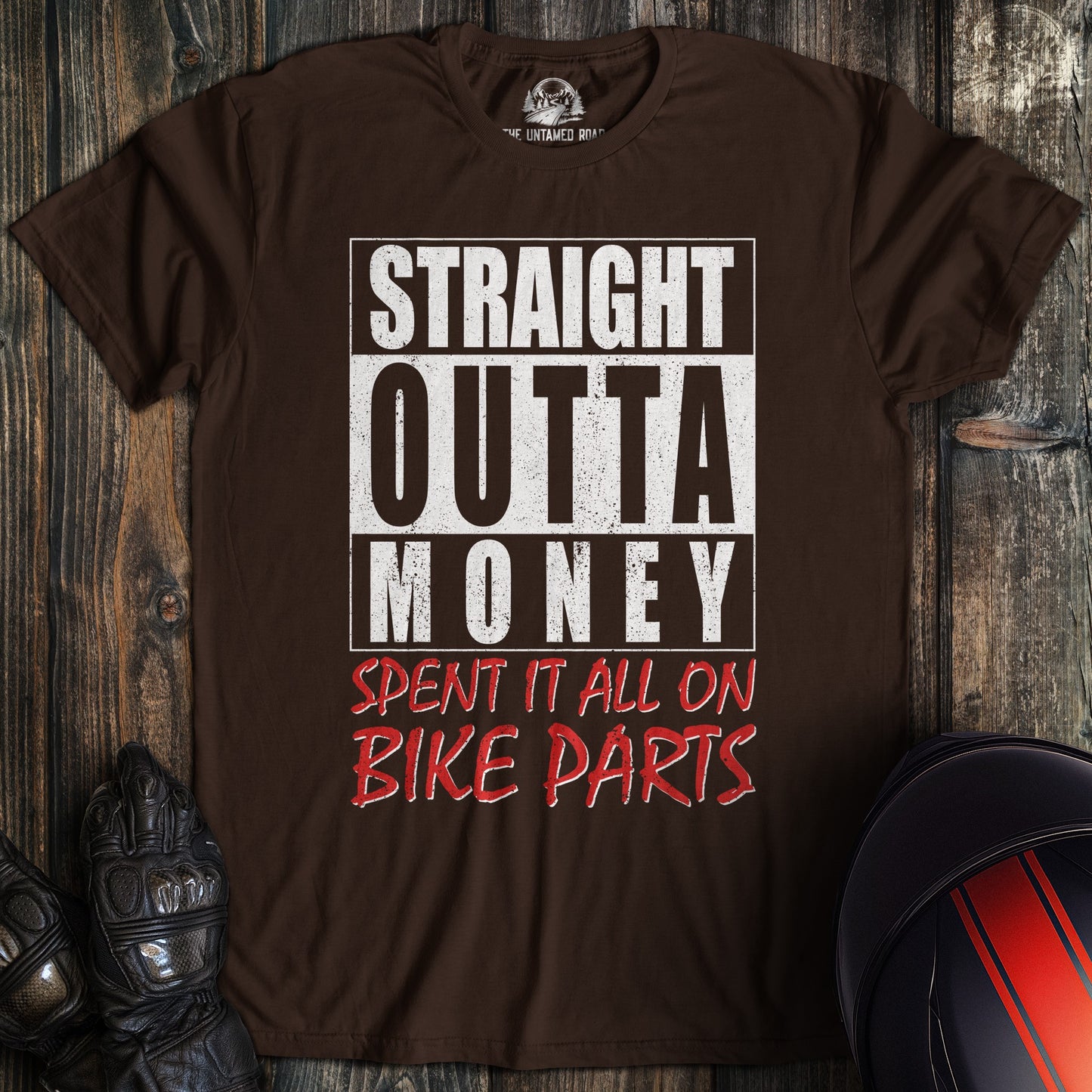 A dark chocolate colored t-shirt with the words "straight outta money 2" printed on the front.