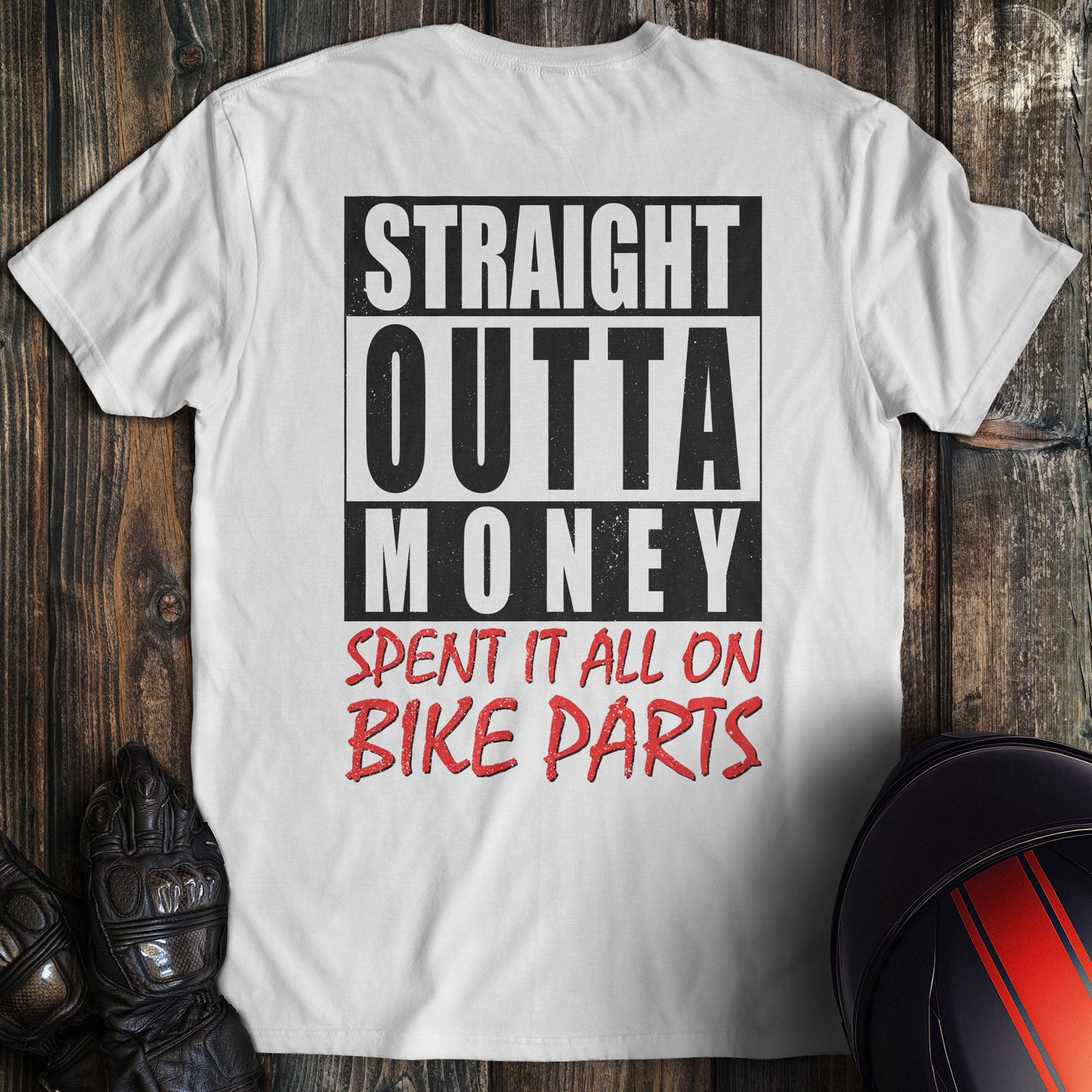 A white colored t-shirt with the words "straight outta money 2" printed on the back.
