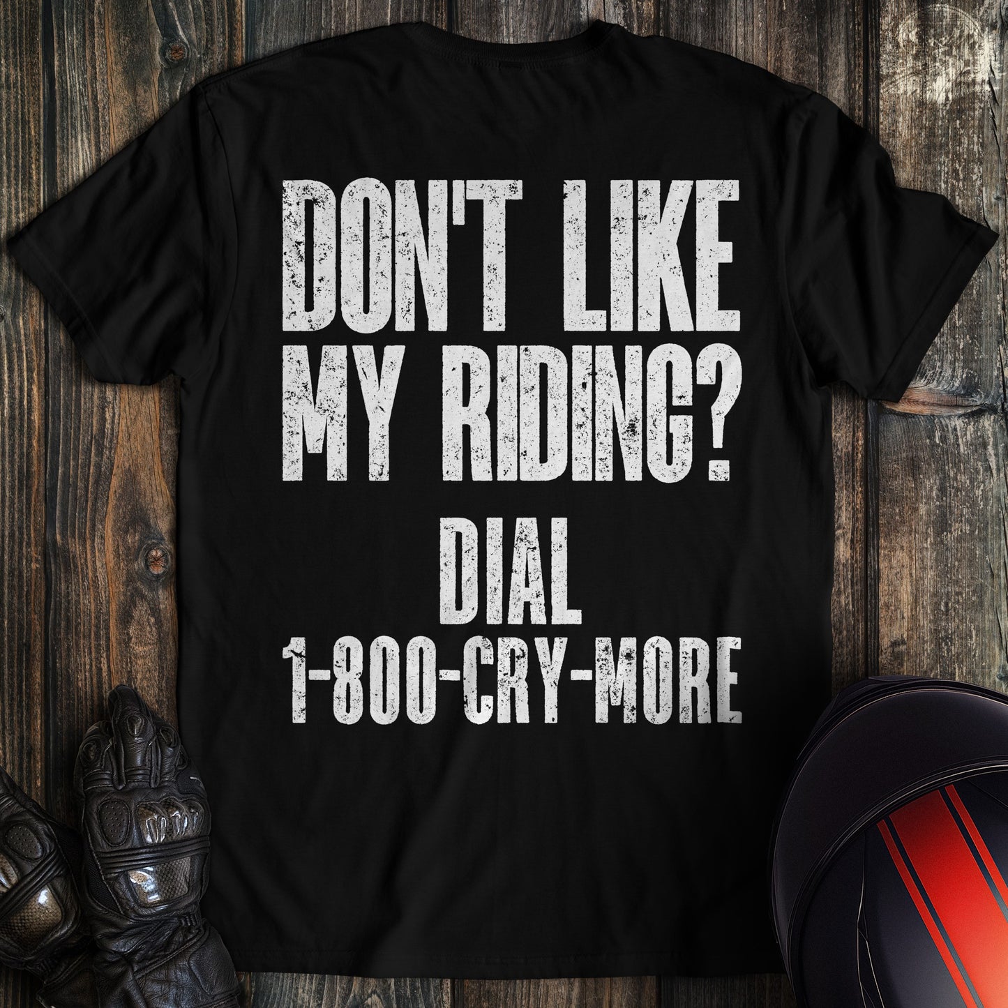 A black colored t-shirt with the words "riding complaint clean" printed on the back.