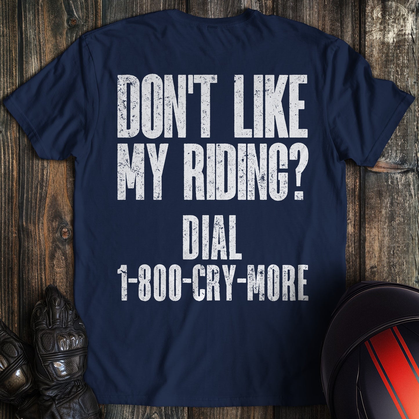 A navy colored t-shirt with the words "riding complaint clean" printed on the back.