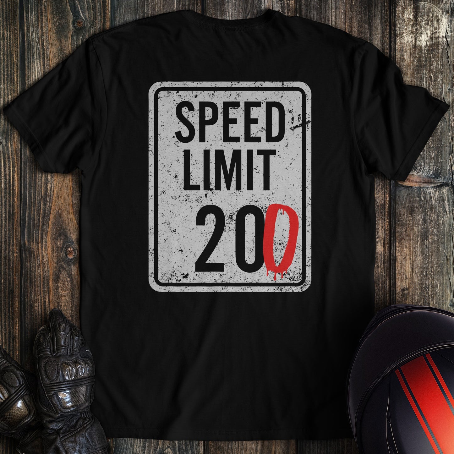 A black colored t-shirt with the words "speed limit" printed on the back.