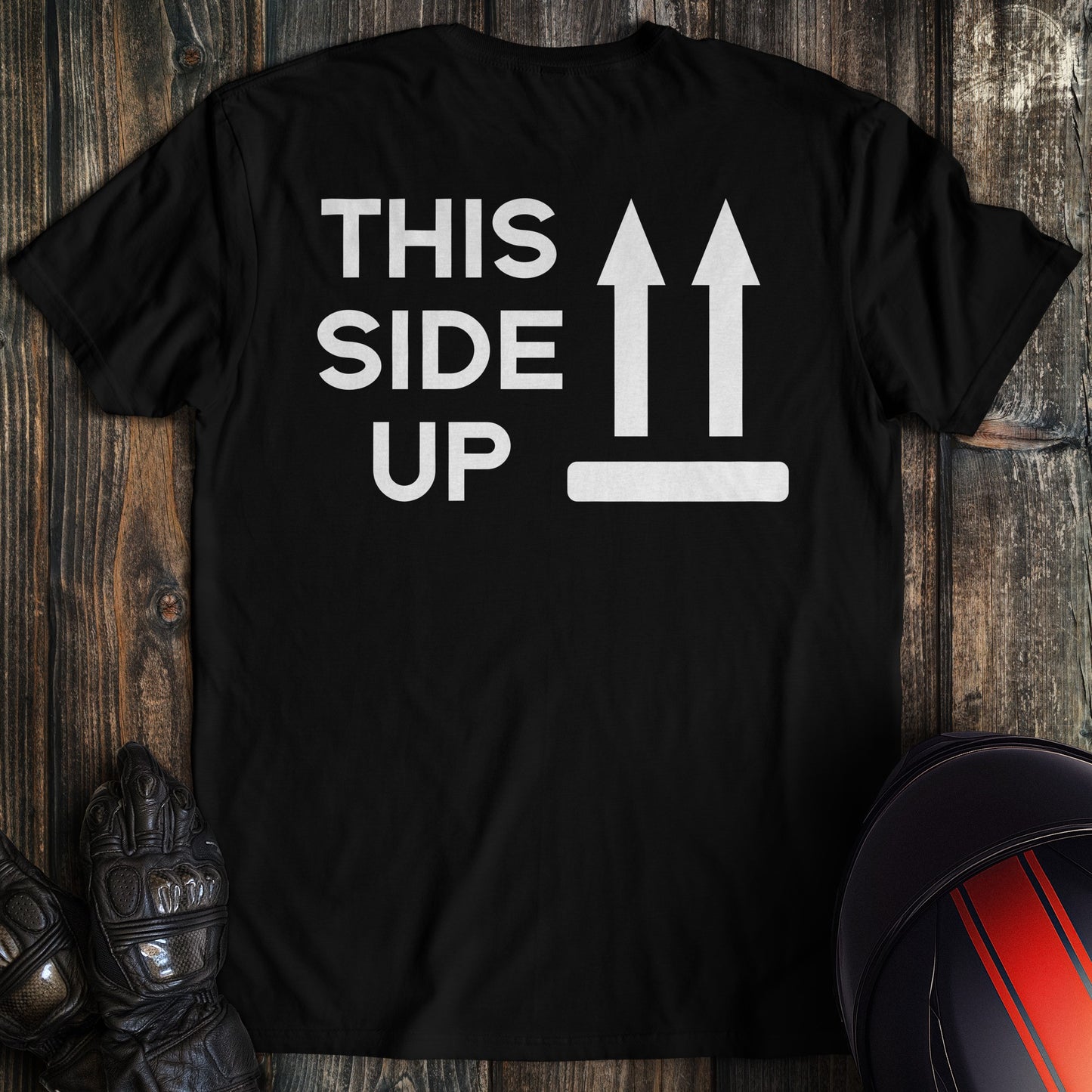 A black colored t-shirt with the words "this side up" printed on the back.