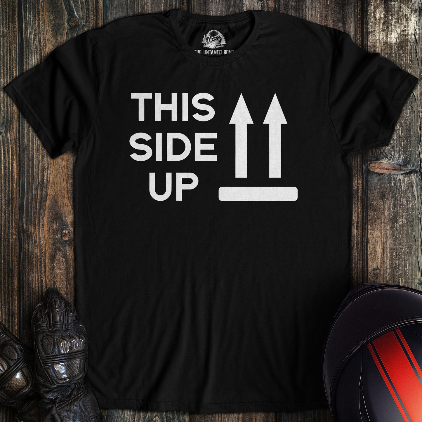 A black colored t-shirt with the words "this side up" printed on the front.