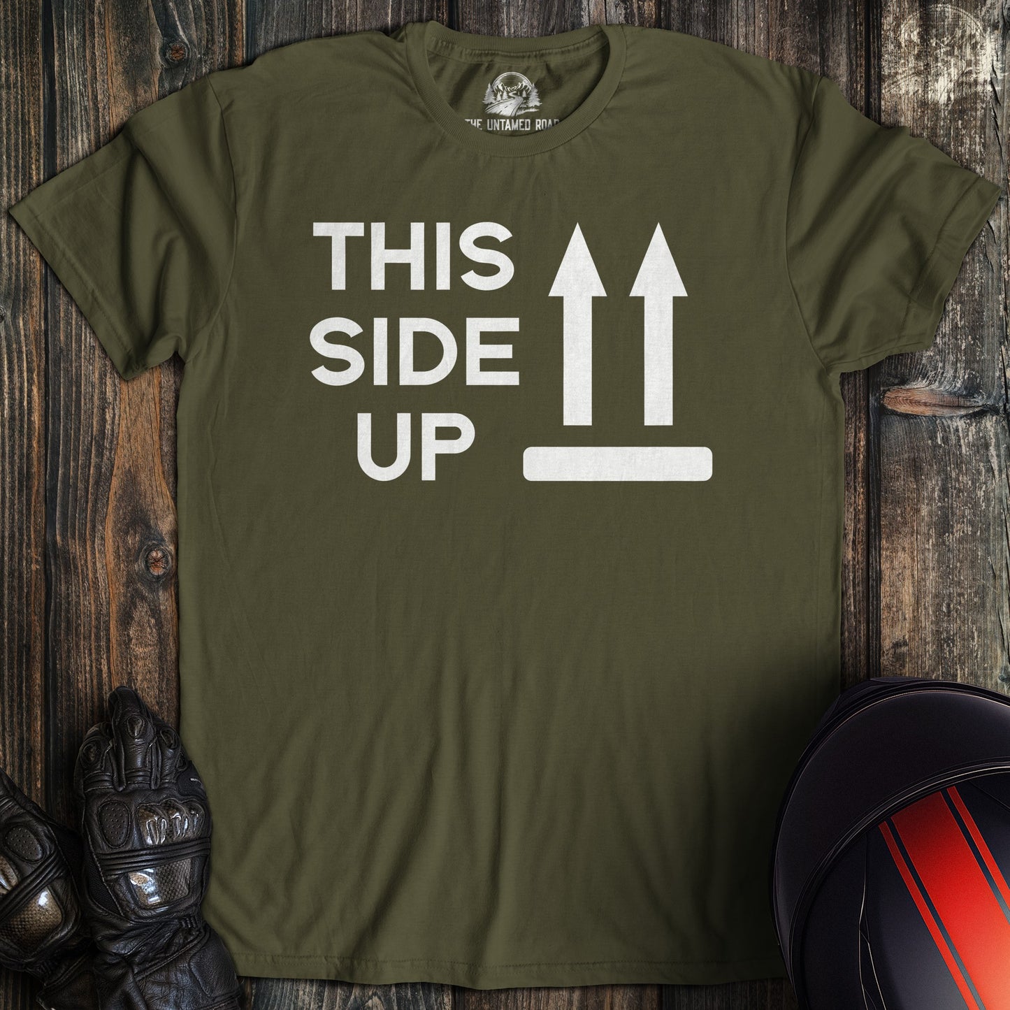 A military green colored t-shirt with the words "this side up" printed on the front.