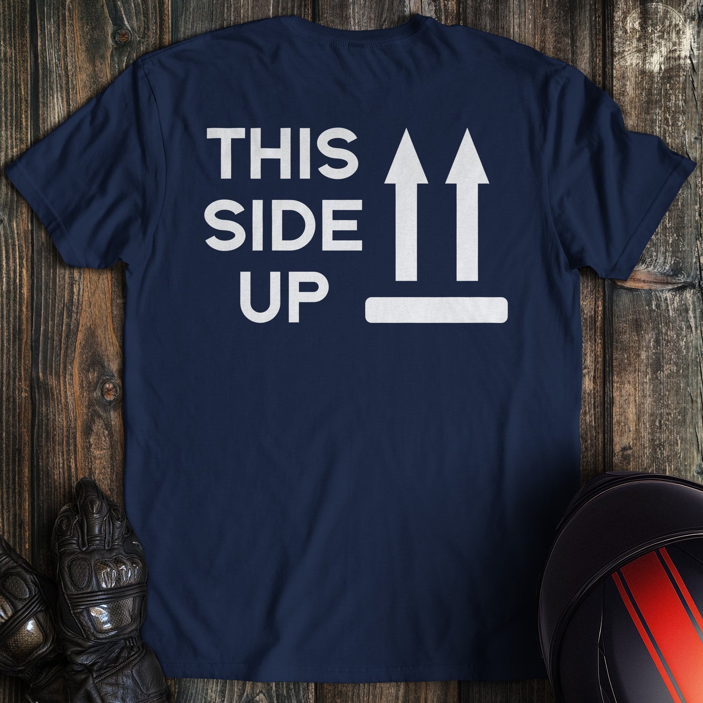A navy colored t-shirt with the words "this side up" printed on the back.