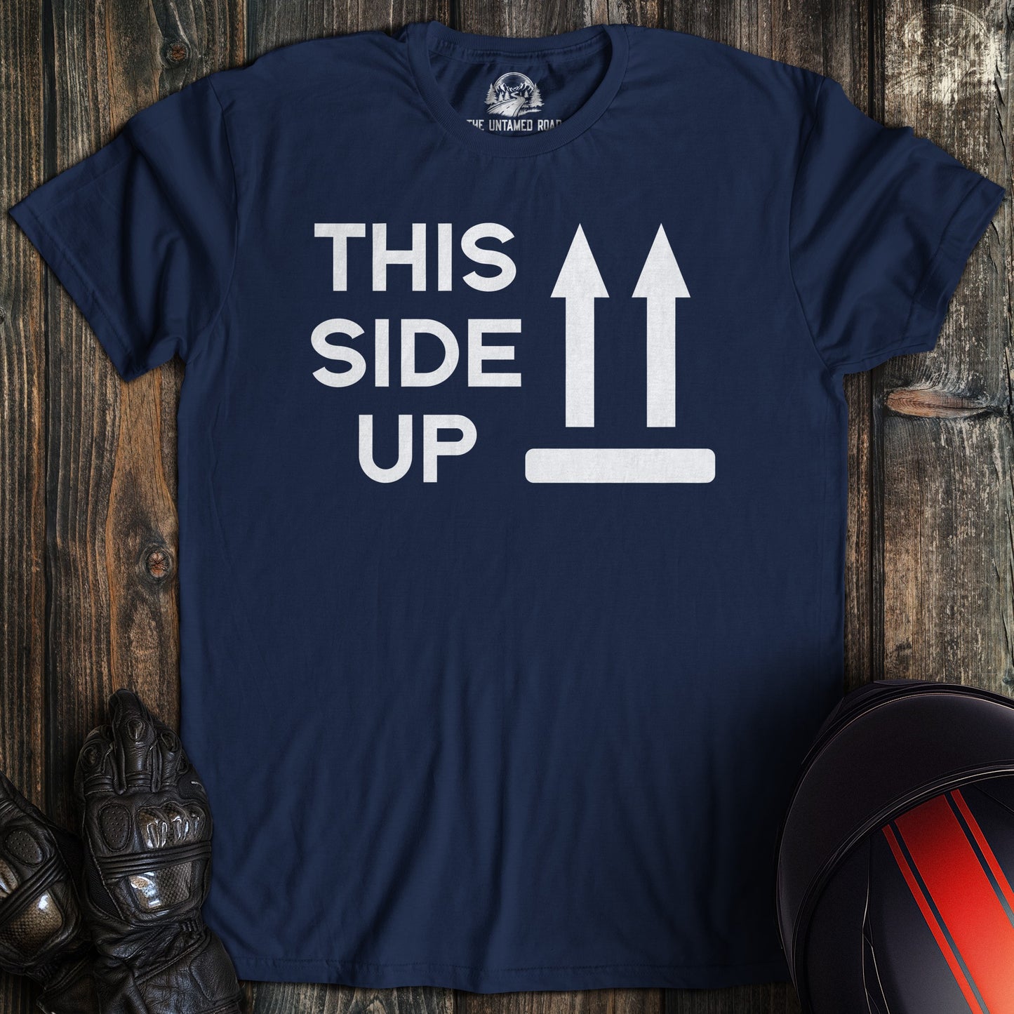 A navy colored t-shirt with the words "this side up" printed on the front.