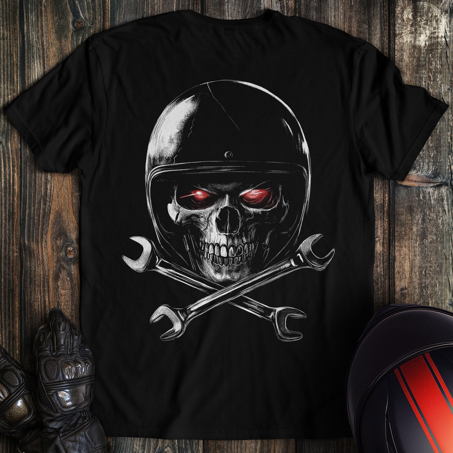 A black colored t-shirt with the words "skull and wrenches 2" printed on the back.
