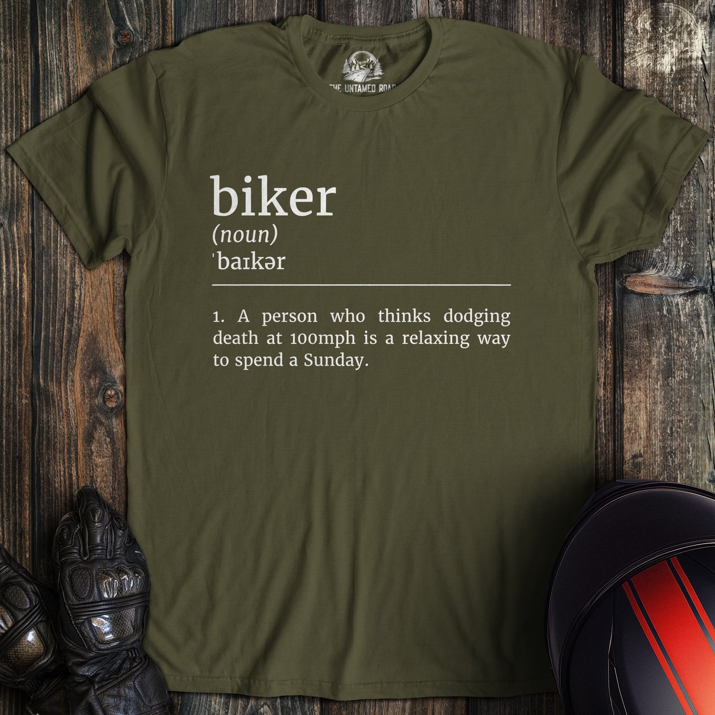 A military green colored t-shirt with the words "biker definition 2" printed on the front.