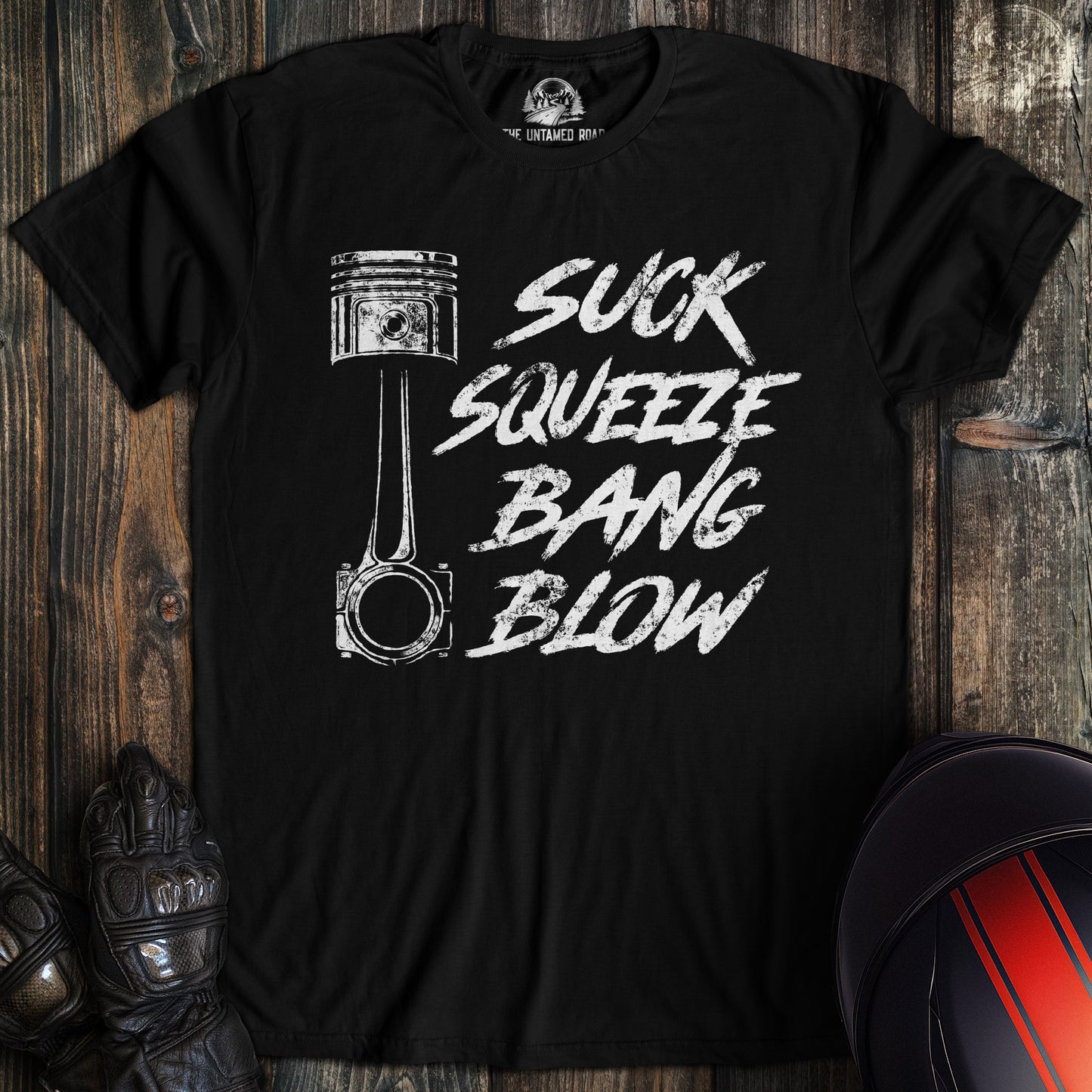 A black colored t-shirt with the words "suck squeeze bang blow" printed on the front.