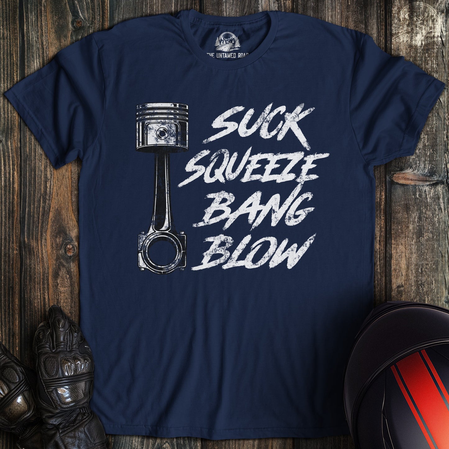 A navy colored t-shirt with the words "suck squeeze bang blow" printed on the front.