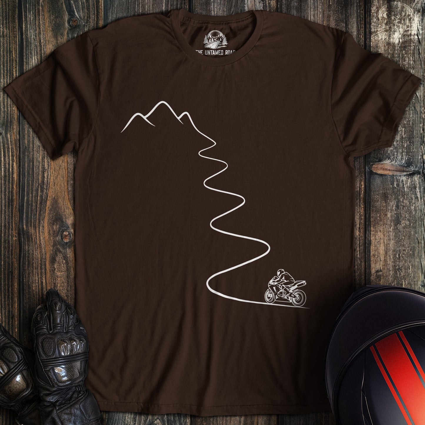 A dark chocolate colored t-shirt with the words "mountain bike" printed on the front.