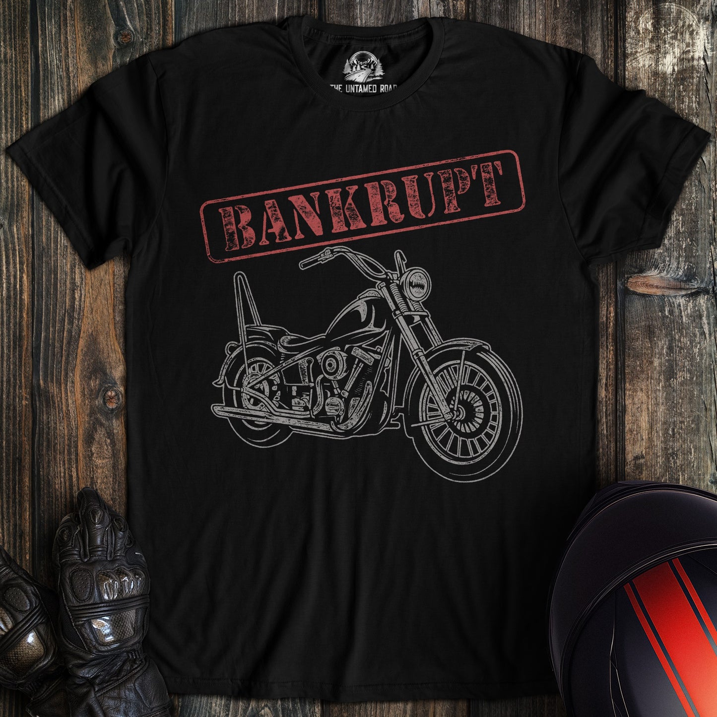 A black t-shirt featuring a white line drawing of a motorcycle below the word BANKRUPT in a red distressed stamp box.