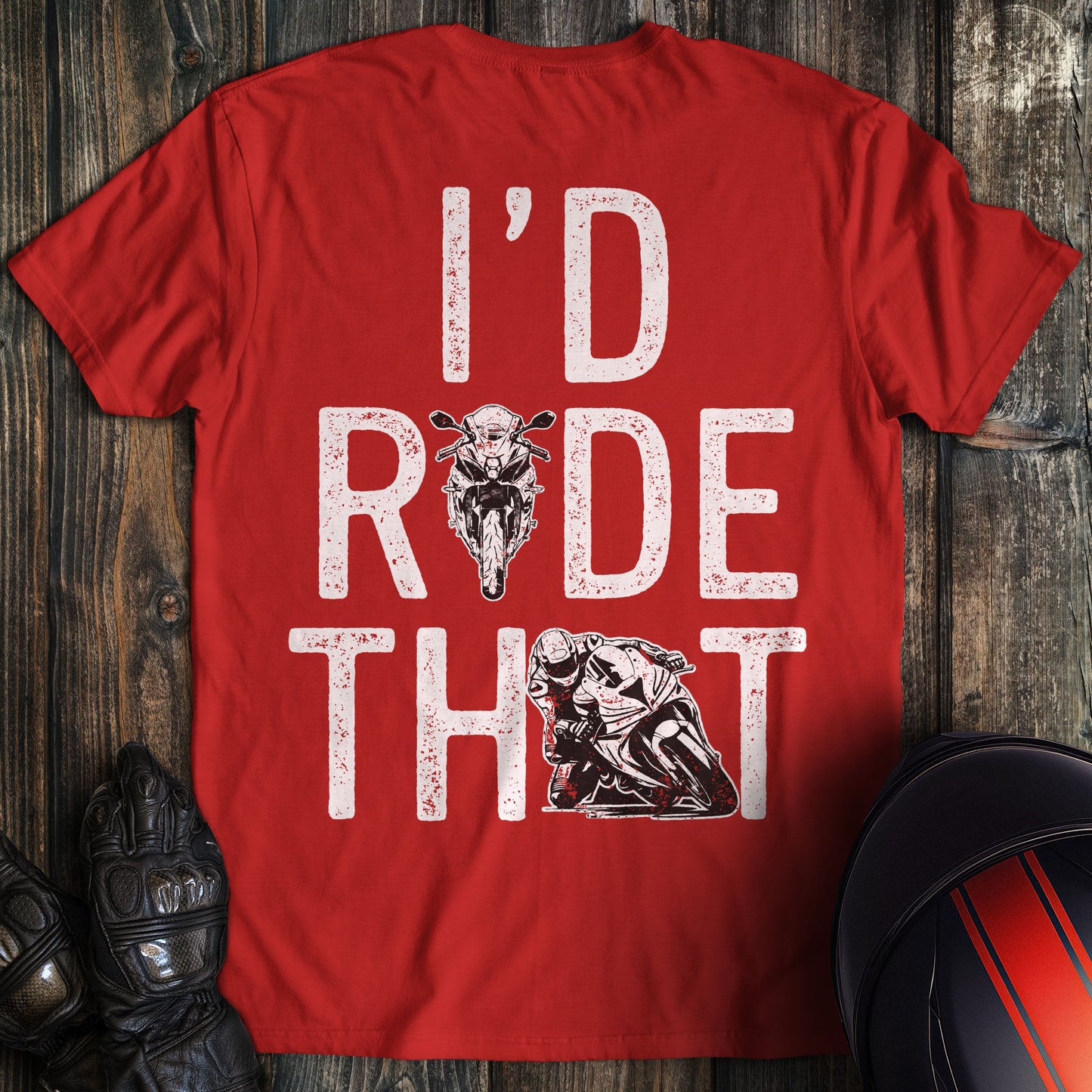 A red t-shirt featuring the text 'I'D RIDE THAT' in a distressed white font with motorcycle and biker graphics.
