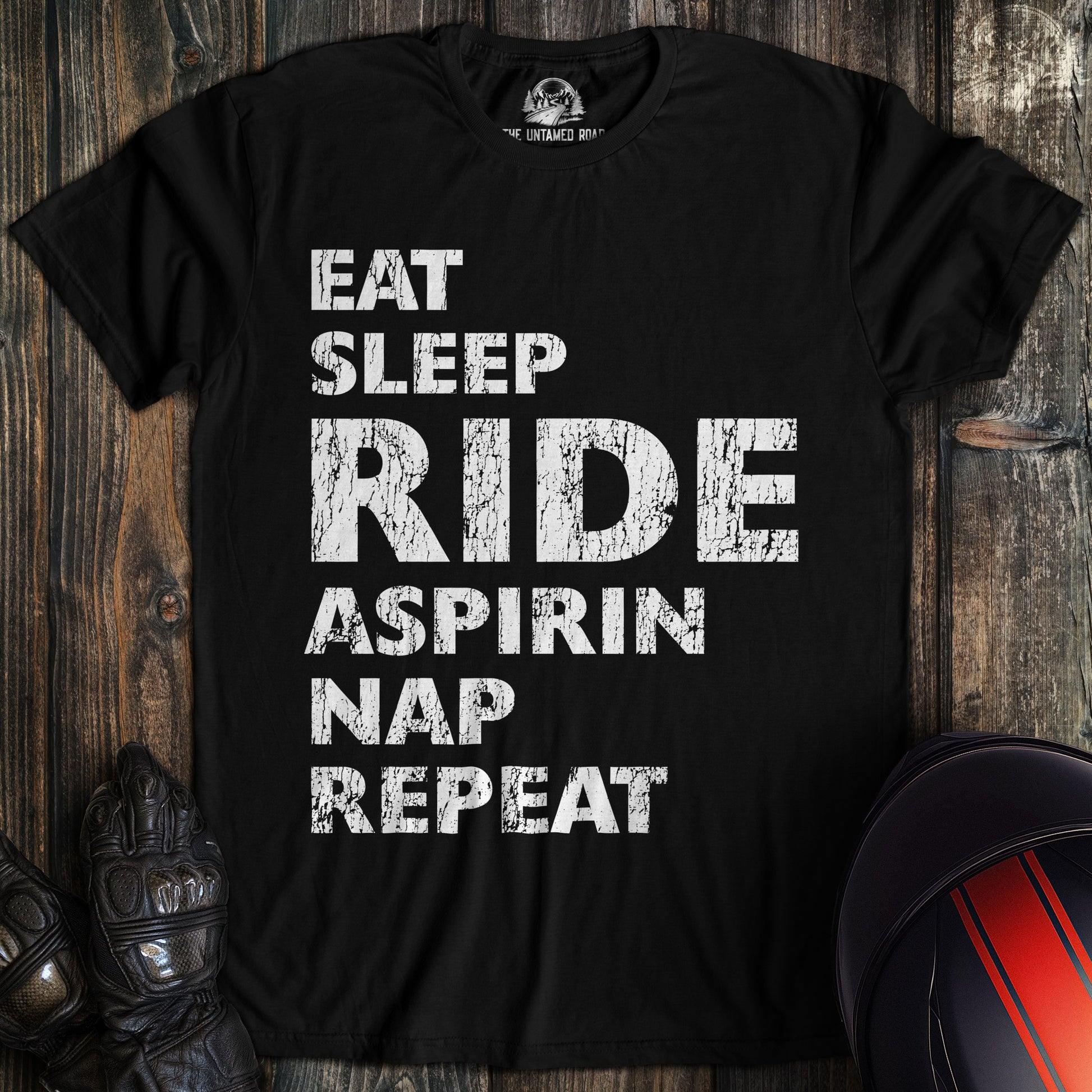 A black colored t-shirt with the words "eat sleep ride" printed on the front.