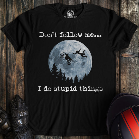 A black colored t-shirt with the words "dont follow me dirtbike" printed on the front.