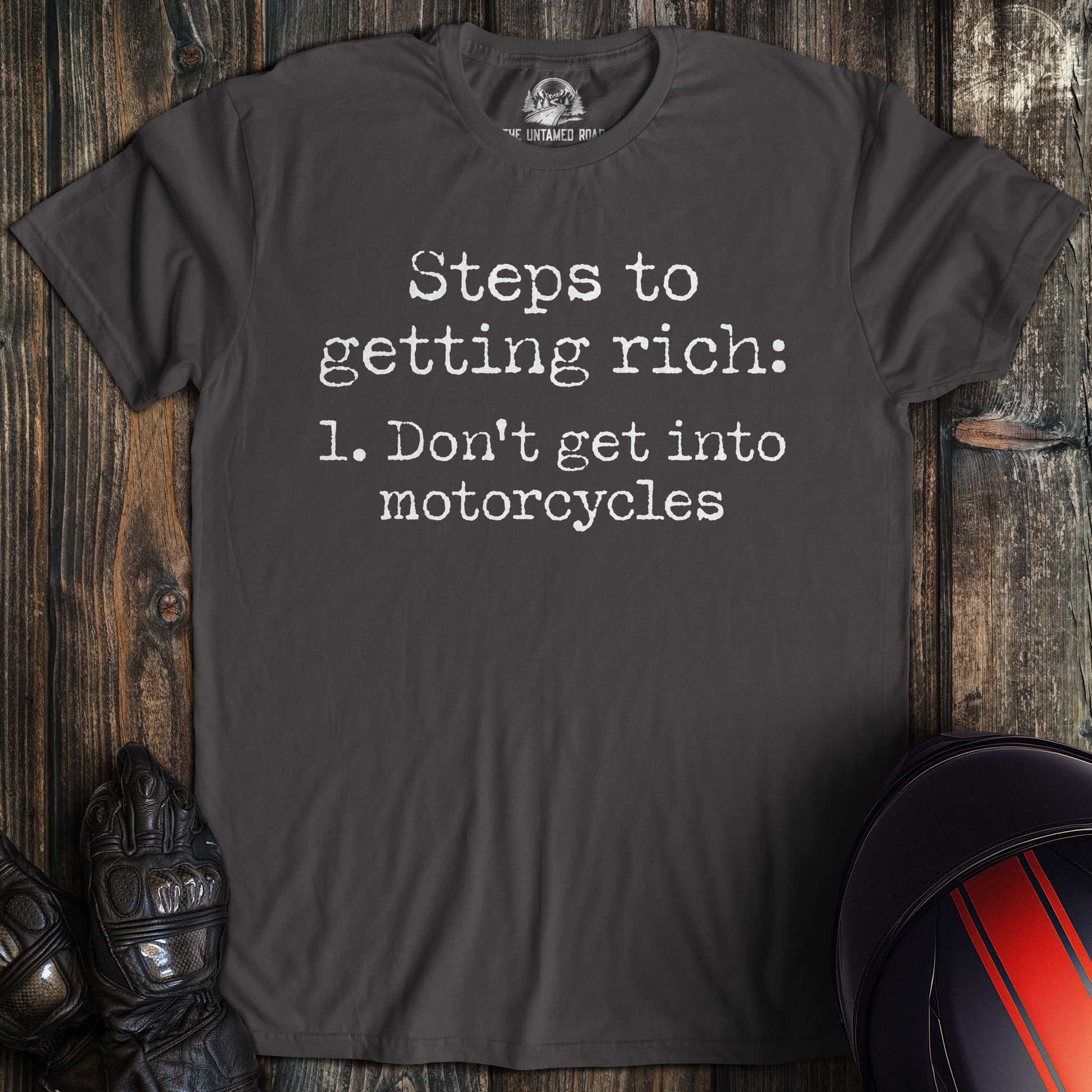 Charcoal gray t-shirt with funny text: Steps to getting rich: 1. Don't get into motorcycles.