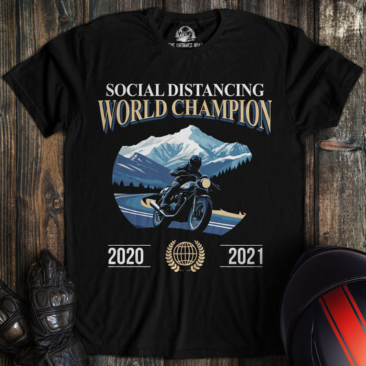 A black colored t-shirt with the words "social distance champ" printed on the front.