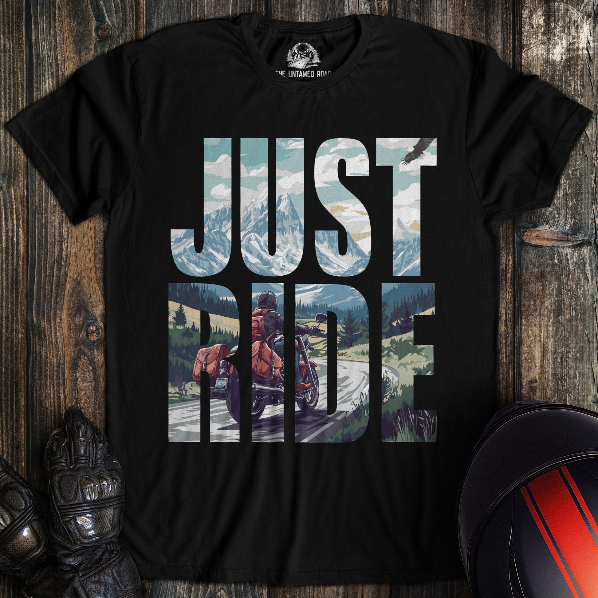 A black colored t-shirt with the words "just ride" printed on the front.