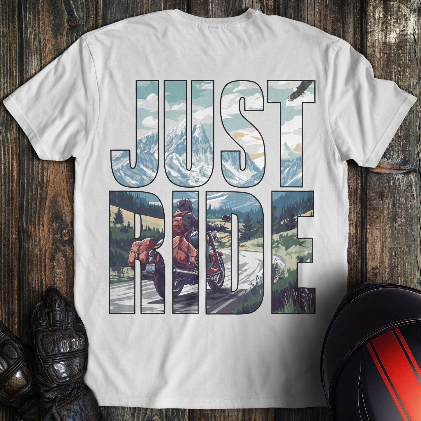 A white colored t-shirt with the words "just ride" printed on the back.