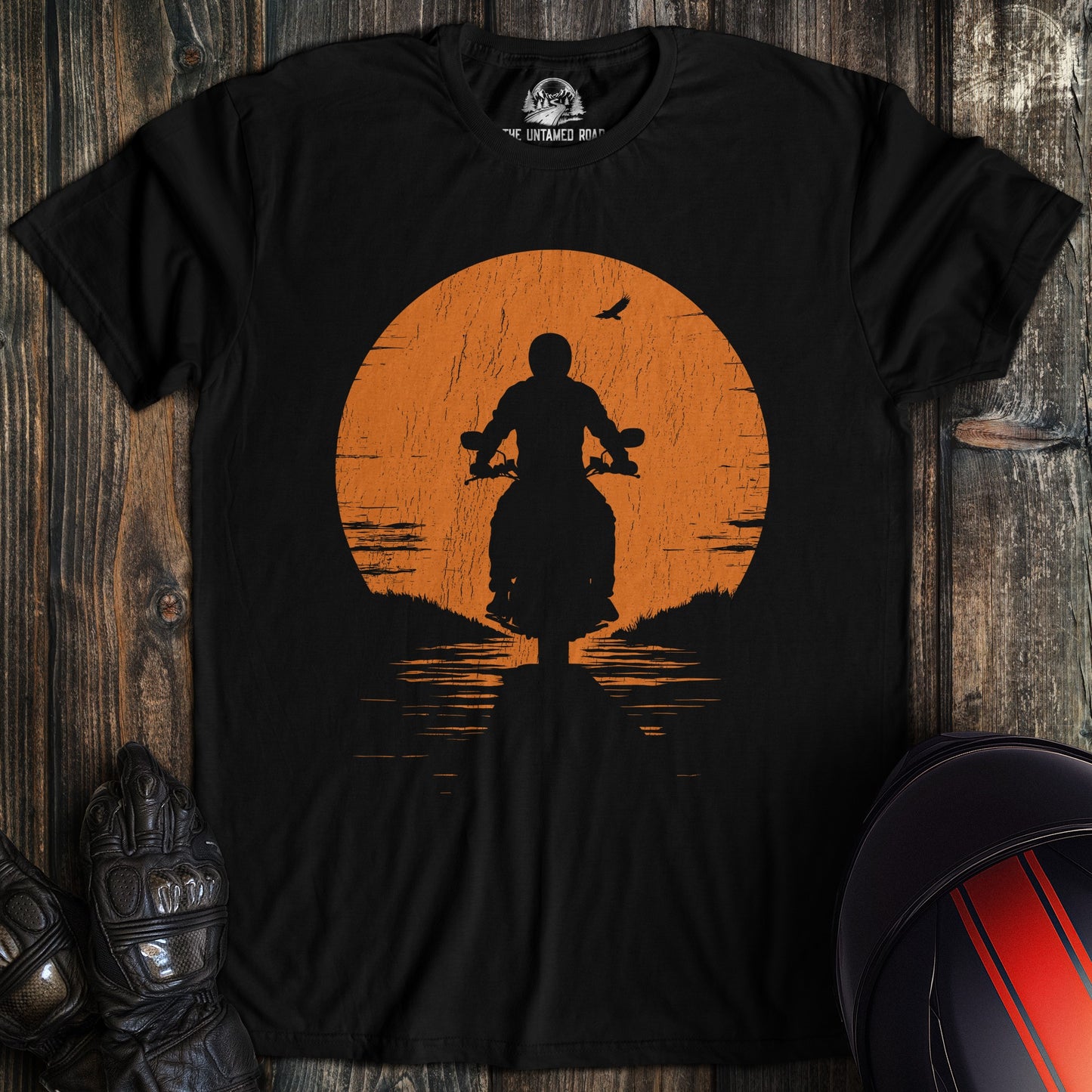 A black colored t-shirt with the words "sunset" printed on the front.