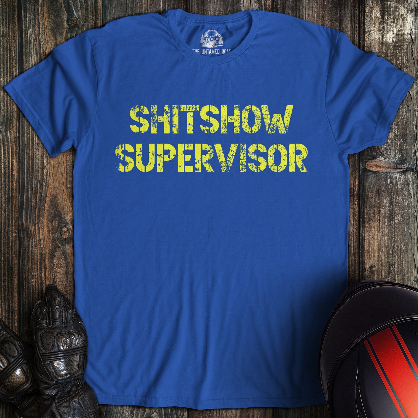 A royal blue colored t-shirt with the words "shitshow supervisor" printed on the front.