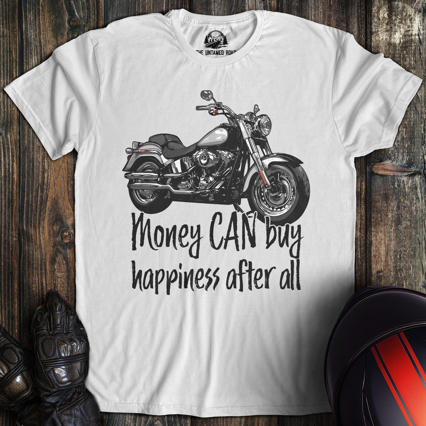 A white colored t-shirt with the words "money can buy happiness" printed on the front.
